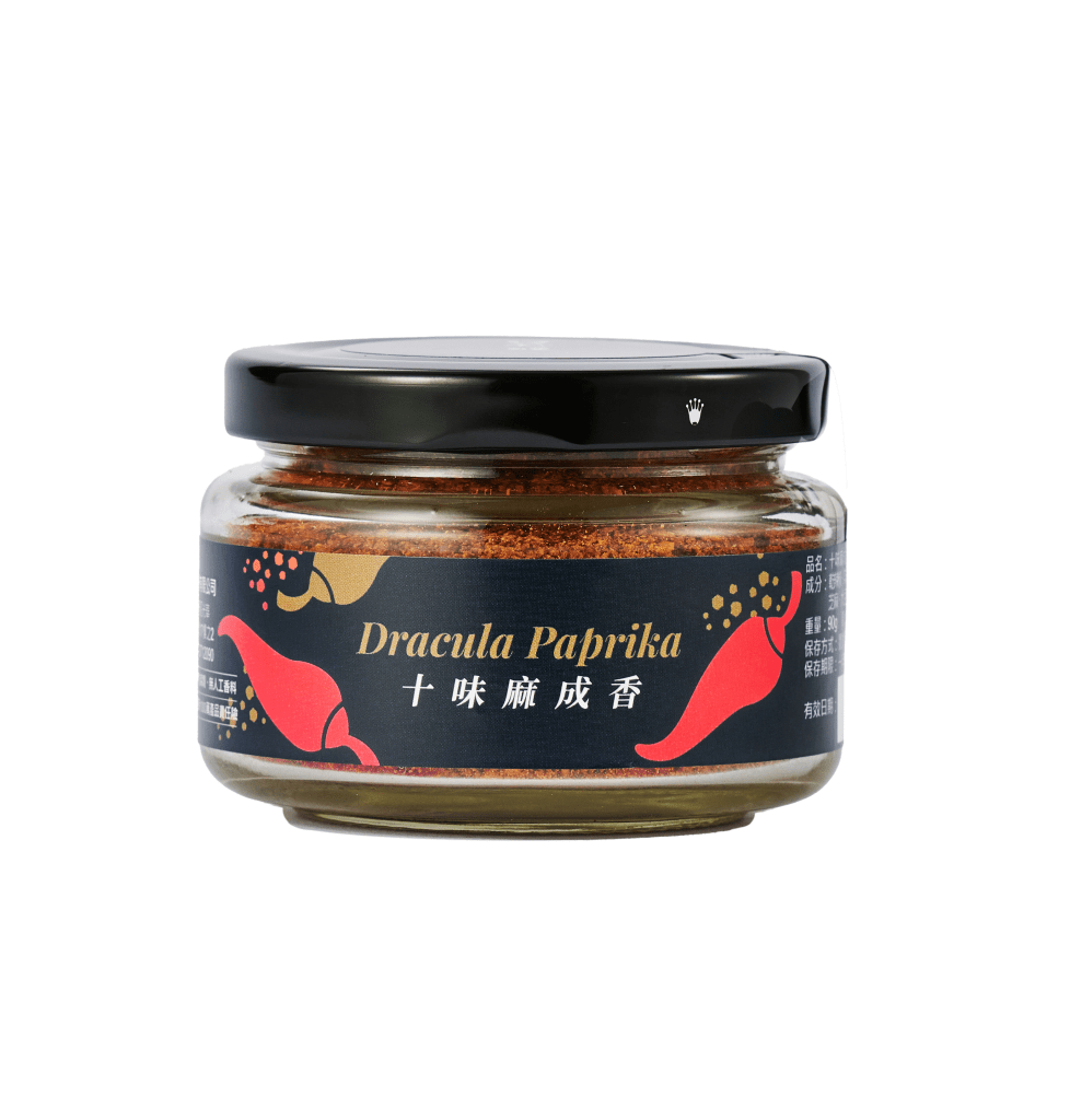 A jar of Awakened Taste Dracula Paprika with a label featuring red chili peppers and the product name in English and Chinese.